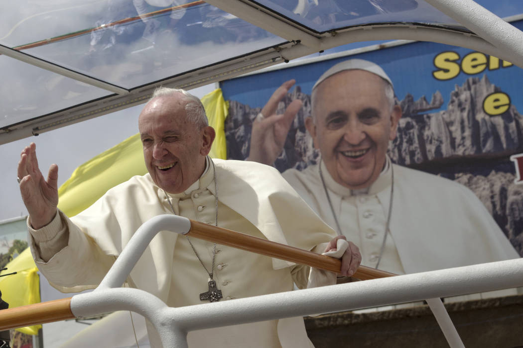 Pope Francis greets worshippers after celebrating a Mass in Antananarivo, Madagascar, Sunday, S ...