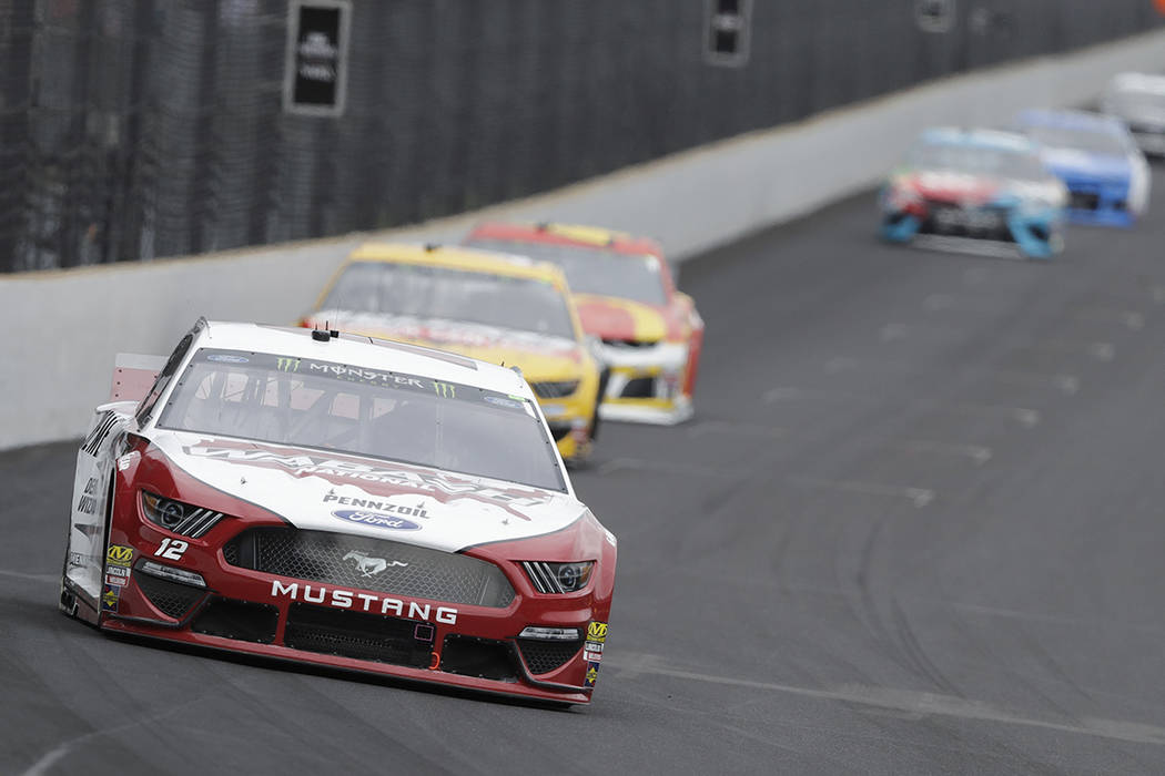 NASCAR Cup Series driver Ryan Blaney drives into turn one during the NASCAR Brickyard 400 auto ...