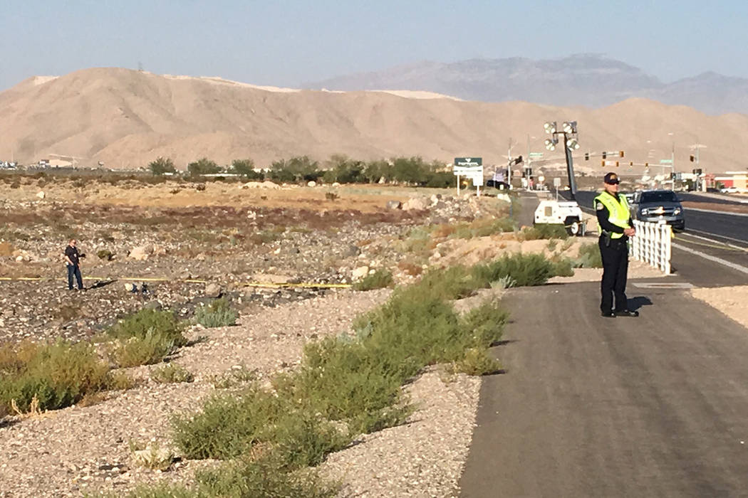 Investigators on scene after a small propeller plane crashed near Henderson Executive Airport o ...