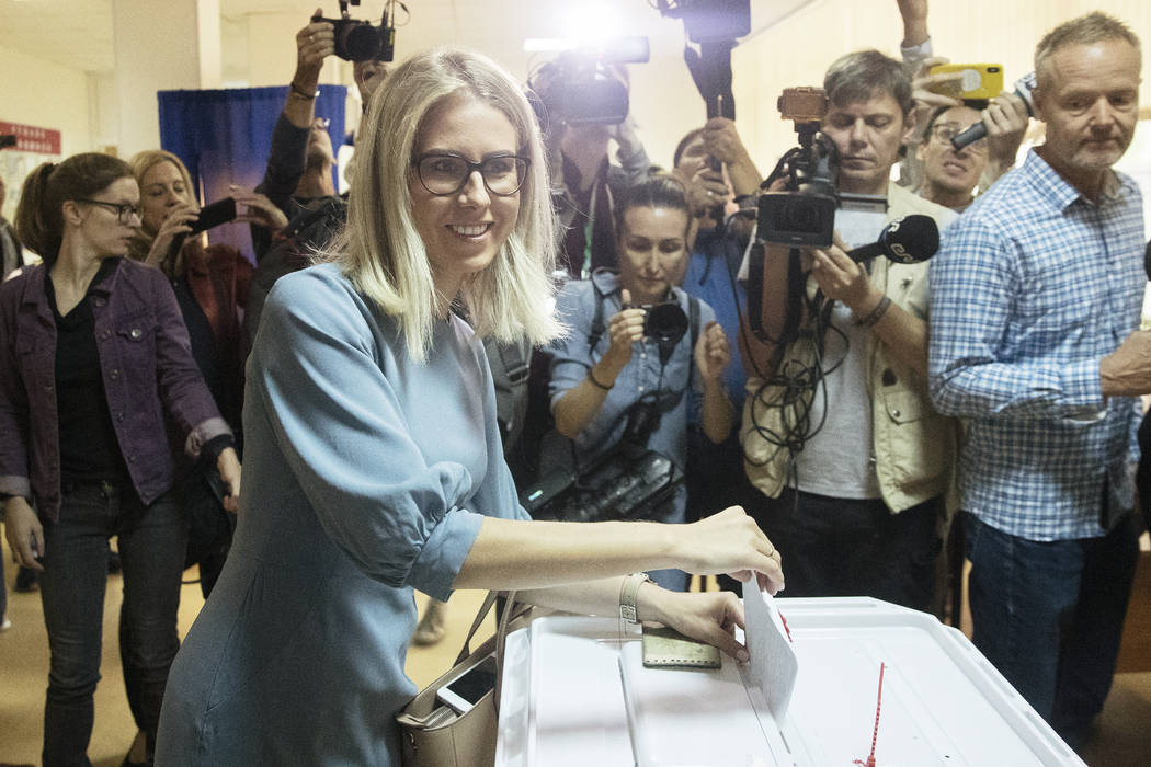 Russian opposition activist Lyubov Sobol casts her vote during a city council election in Mosco ...