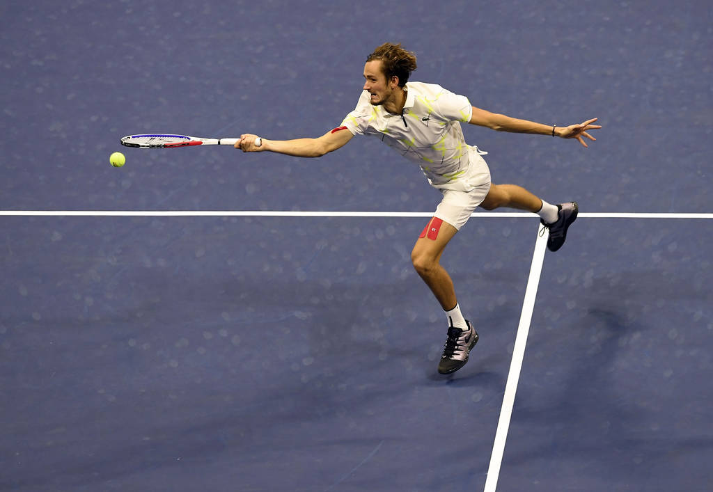 Daniil Medvedev, of Russia, returns a shot to Rafael Nadal, of Spain, during the men's singles ...