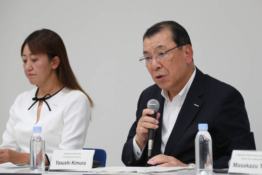 Nissan Motor Co.'s chair of the board of directors Yasushi Kimura, right, speaks during a press ...