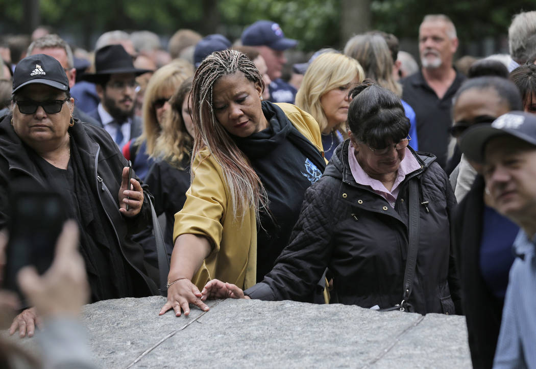 FILE- In this May 30, 2019 file photo, people gather around stones that are part of the new 9/1 ...