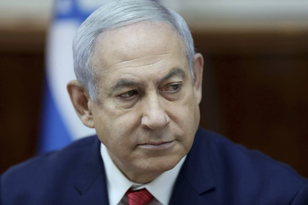 Israeli Prime Minister Benjamin Netanyahu chairs the weekly cabinet meeting, at his office in J ...