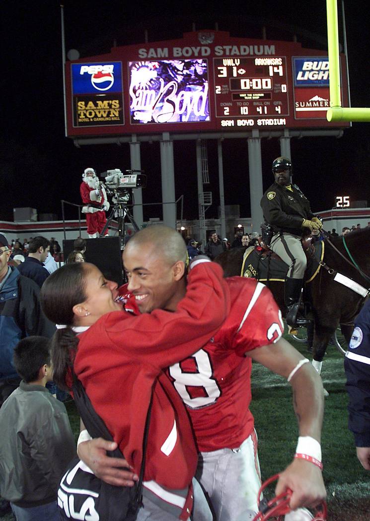 UNLV cornerback Kevin Thomas gets a hug from his girlfriend Janae Sims after the Rebel's Las V ...