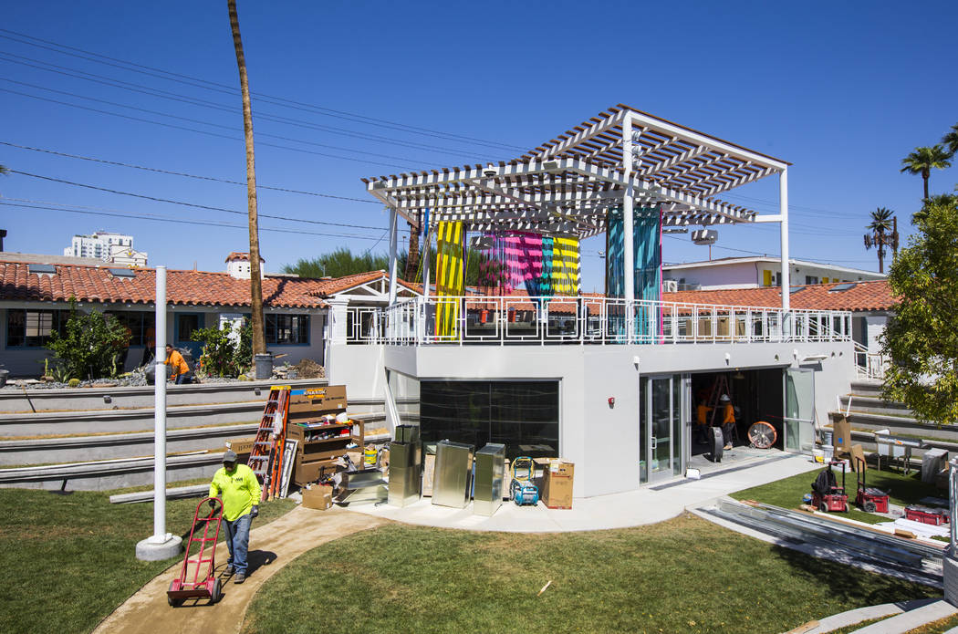 The space for Mothership Coffee is seen under construction below with a patio deck above featur ...