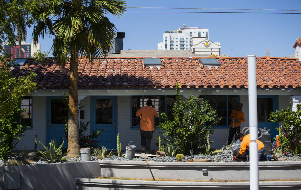 Workers update the landscaping at Fergusons Downtown at Fremont and 11th streets in Las Vegas o ...