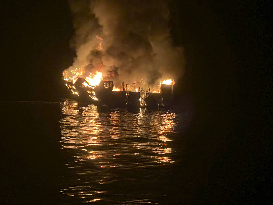 A dive boat is engulfed in flames after a deadly fire broke out aboard the commercial scuba div ...