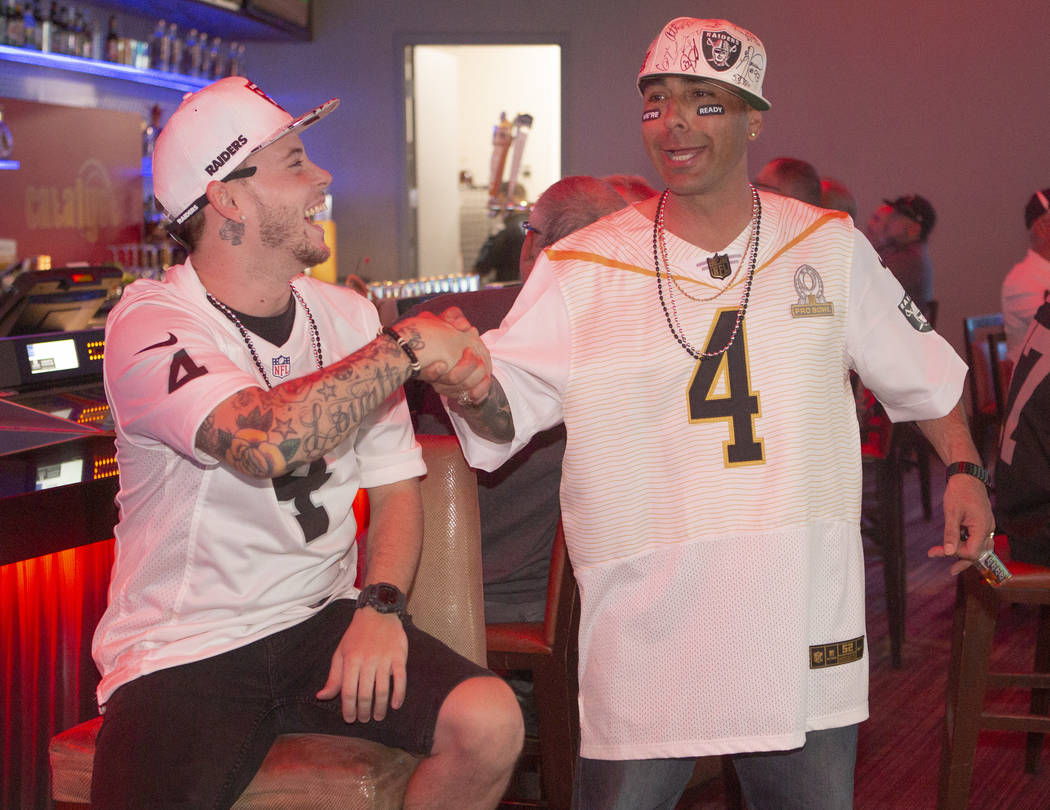 Kevin Petersen, left, shakes hands with Chad Braden, right, from Los Angeles, after the raiders ...