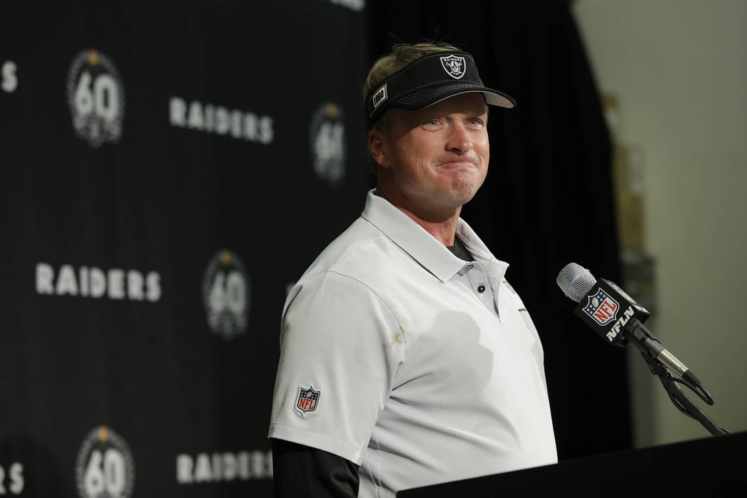 Oakland Raiders head coach Jon Gruden smiles during a news conference at the end of an NFL foot ...