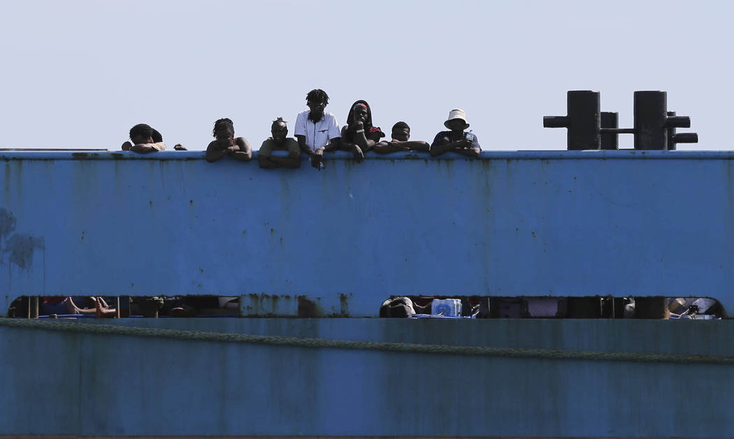 People look out from a ferry as they wait to be evacuated to Nassau in the aftermath of Hurrica ...