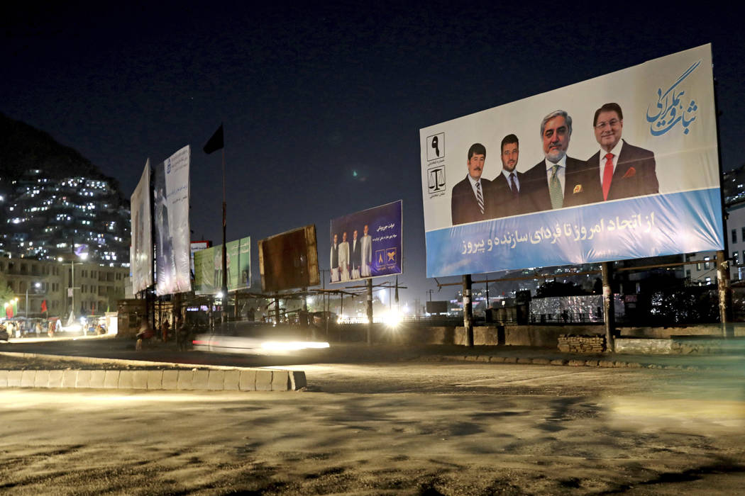 In this Sept. 9, 2019, photo, a poster of presidential candidate Abdullah Abdullah sits on the ...