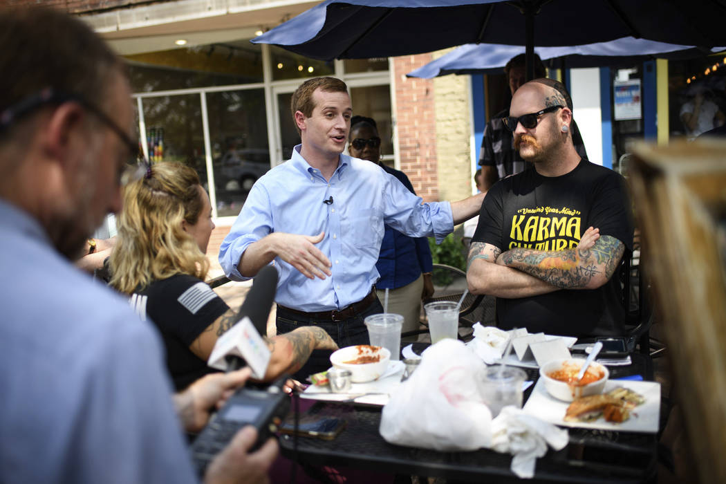 Dan McCready, a Democratic candidate for North Carolina's 9th District, talks to Johnny Ivey wh ...