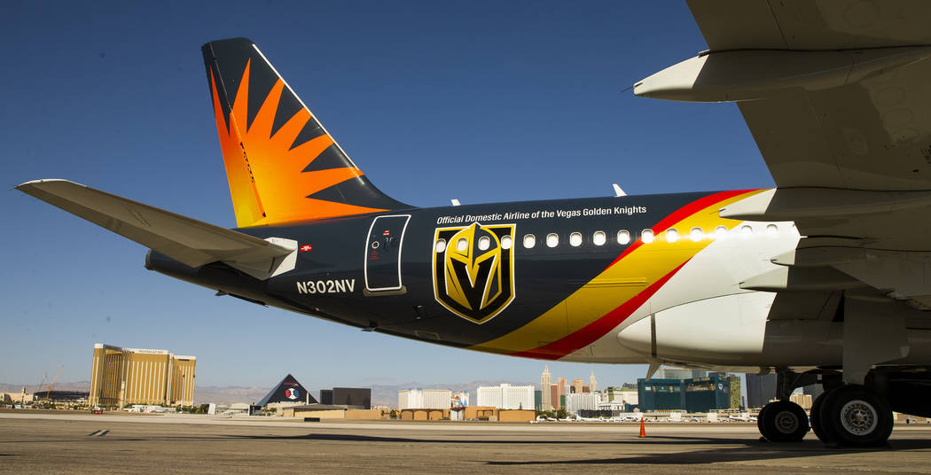 Team markings adorn the plane as Allegiant unveils a new Golden Knights-themed plane at McCarra ...