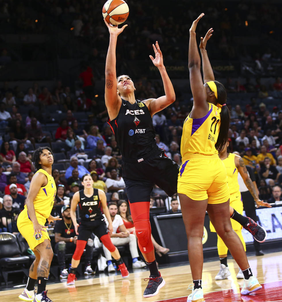 Las Vegas Aces' Liz Cambage shoots against Los Angeles Sparks' Kalani Brown (21) during the fir ...