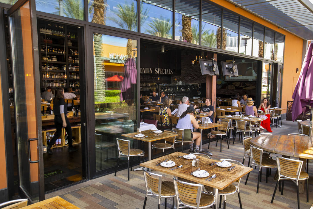 Customers enjoy lunch on the deck at Grape Street Café, Wine Bar & Cellar in Downtown Summerli ...