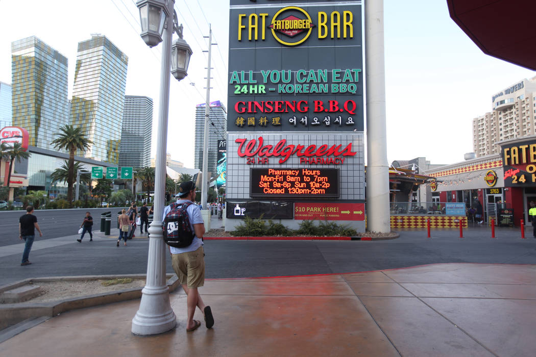 People walk by the Walgreens on the Las Vegas Strip on Tuesday, Sept. 10, 2019, in Las Vegas. T ...