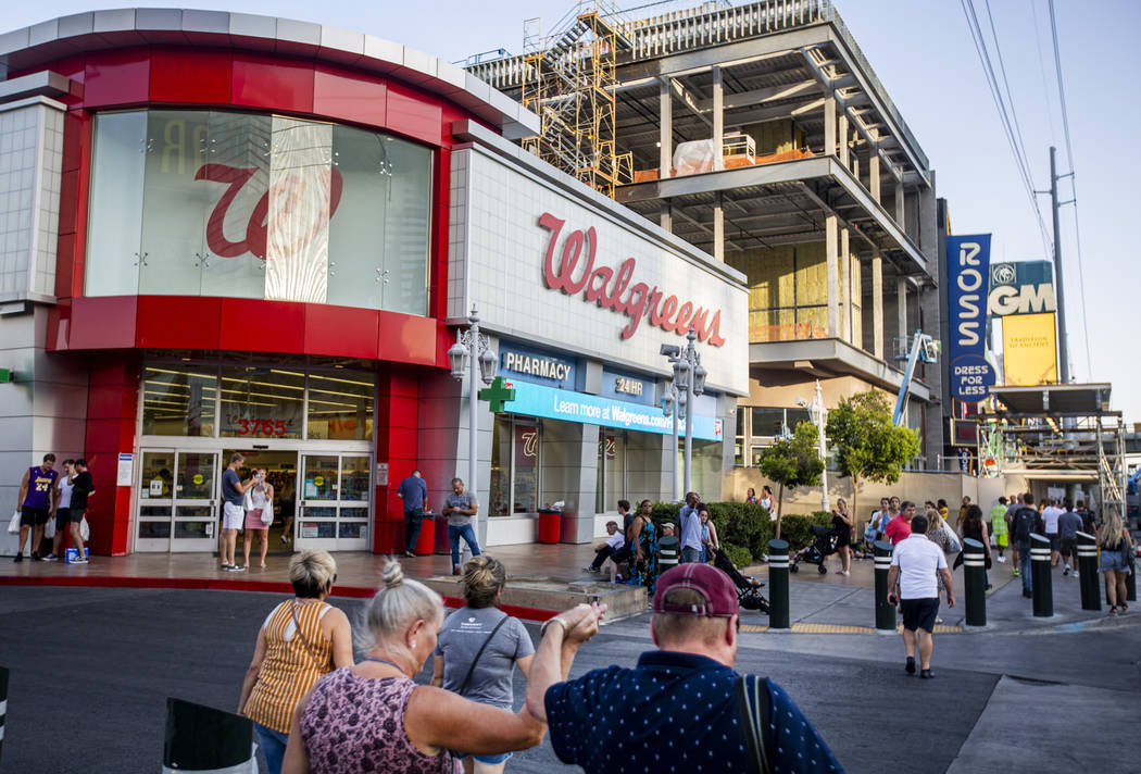 People walk by the Walgreens on the Las Vegas Strip on Tuesday, Sept. 10, 2019, in Las Vegas. T ...