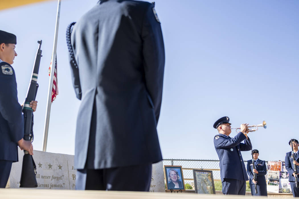 Cadet 1st Lt. Daniel Deleon, 17, plays while a flag is lowered during Palo Verde High School's ...