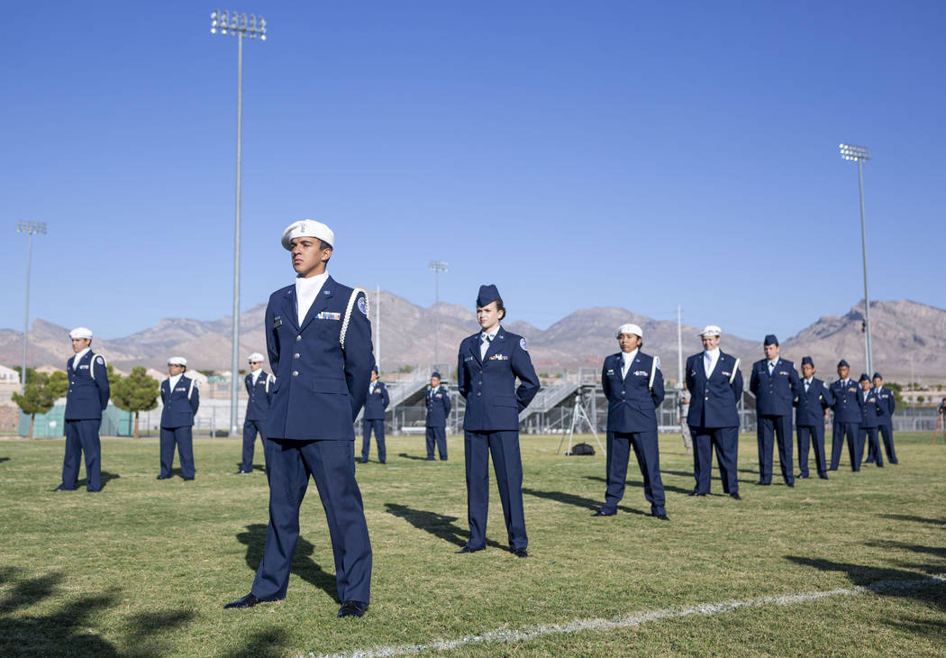 Palo Verde High School students in the Air Force JROTC stand in memory of the school's foreign ...