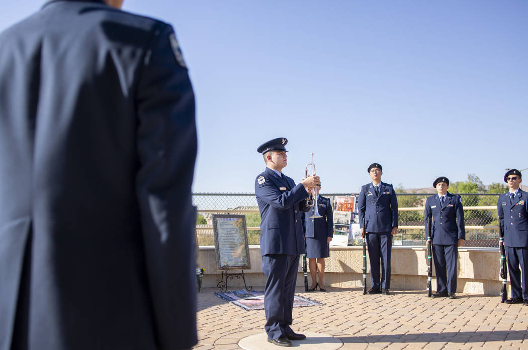 Cadette 1st Lt. Daniel DeLeon, 17, plays while a flag is lowered during Palo Verde High School' ...