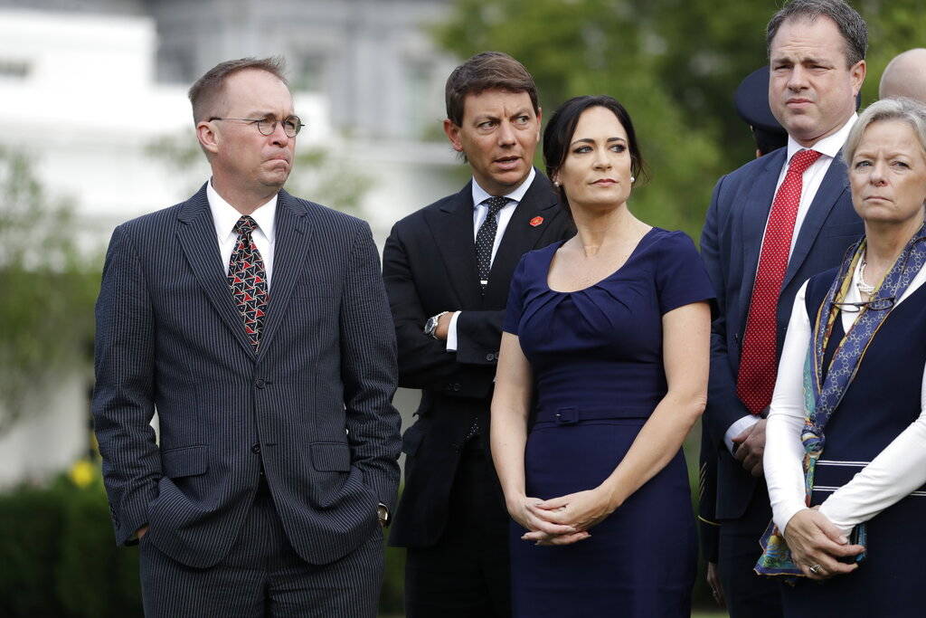 Acting White House Chief of Staff Mick Mulvaney, left, White House deputy press secretary Hogan ...