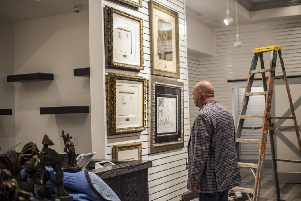 Rick Harrison, co-star of "Pawn Stars" and owner of Gold & Silver Pawn, looks over some of his ...