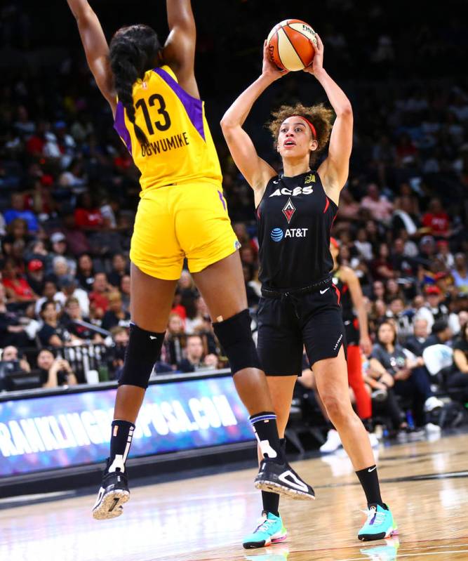 Las Vegas Aces' Dearica Hamby looks to shoot over Los Angeles Sparks' Chiney Ogwumike (13) duri ...