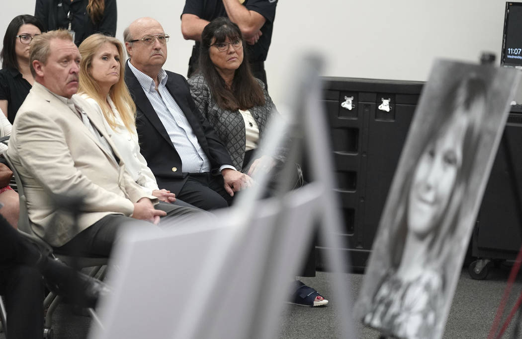 Terri Lynn Hollis' family sits in front of a photo of her during a press conference in Torrance ...