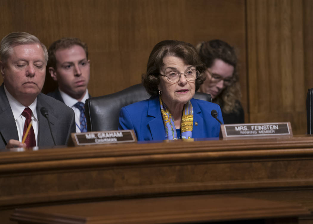 Senate Judiciary Committee Chairman Lindsey Graham, R-S.C., left, listens as Sen. Dianne Feinst ...