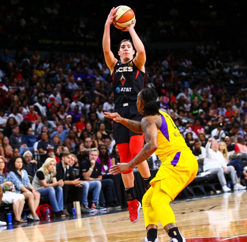 Las Vegas Aces' Kelsey Plum shoots over Los Angeles Sparks' Riquna Williams (2) during the seco ...