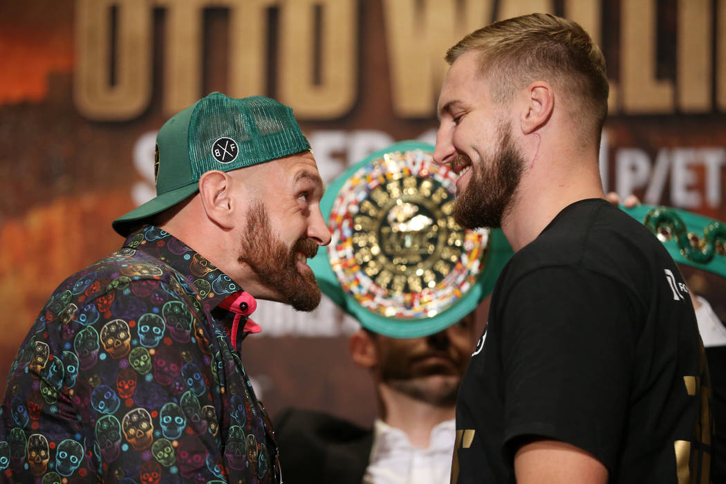 Tyson Fury, left, with Otto Wallin, pose during a press conference at the MGM Grand hotel-casin ...