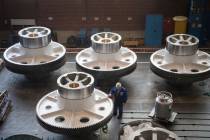 In a March 2, 2018, file photo, a worker cleans big machine parts of presses manufacturer Schü ...