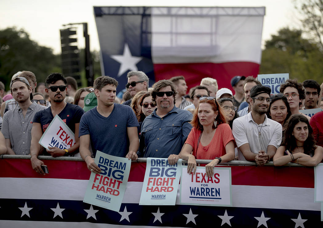 Supporters of Democratic presidential candidate Elizabeth Warren, D-Mass., wait for the candida ...