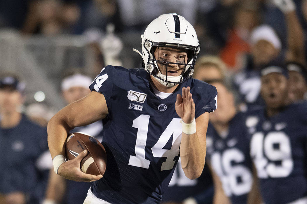 Penn State quarterback Sean Clifford (14) runs during an NCAA college football game in State Co ...