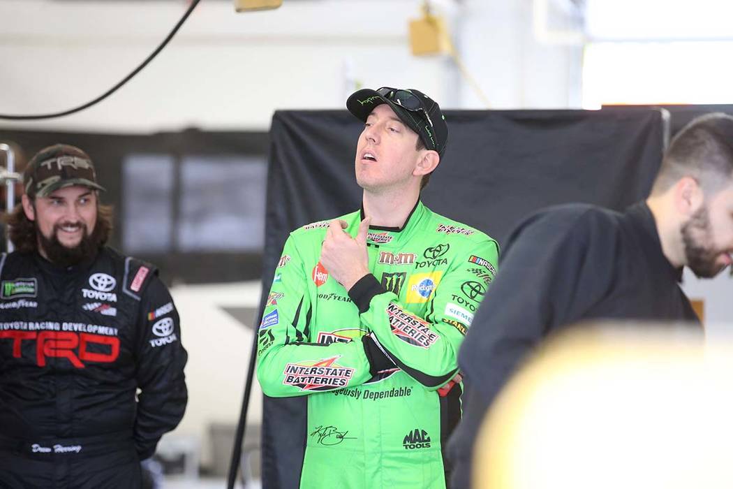 NASCAR driver and Las Vegas native Kyle Busch, center, in his garage during testing at Las Vega ...