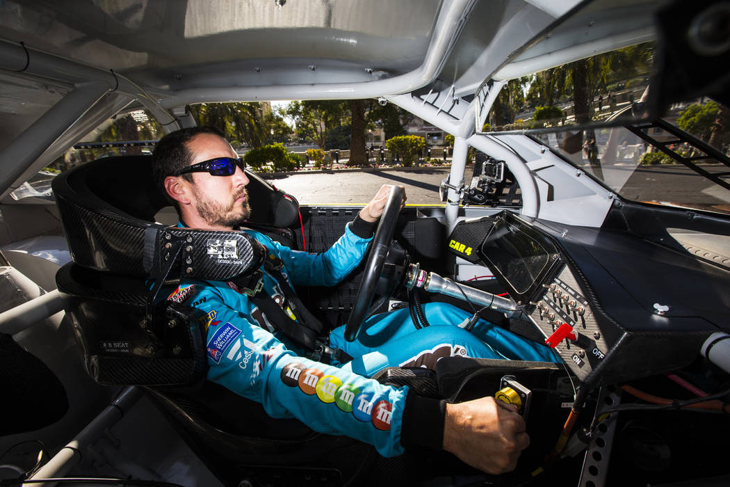 Kyle Busch passes the Bellagio while driving down the Las Vegas Strip before performing a burno ...