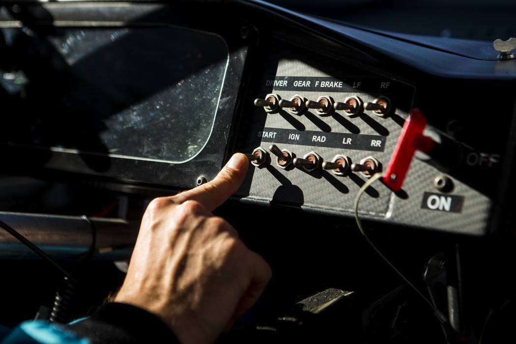 Kyle Busch gets ready to start the engine for the NASCAR America Burnout Boulevard event on the ...