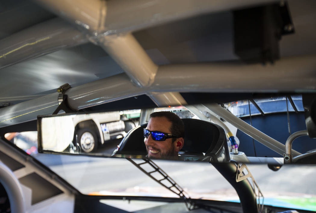 Kyle Busch prepares to perform a burnout as part of the NASCAR America Burnout Boulevard event ...