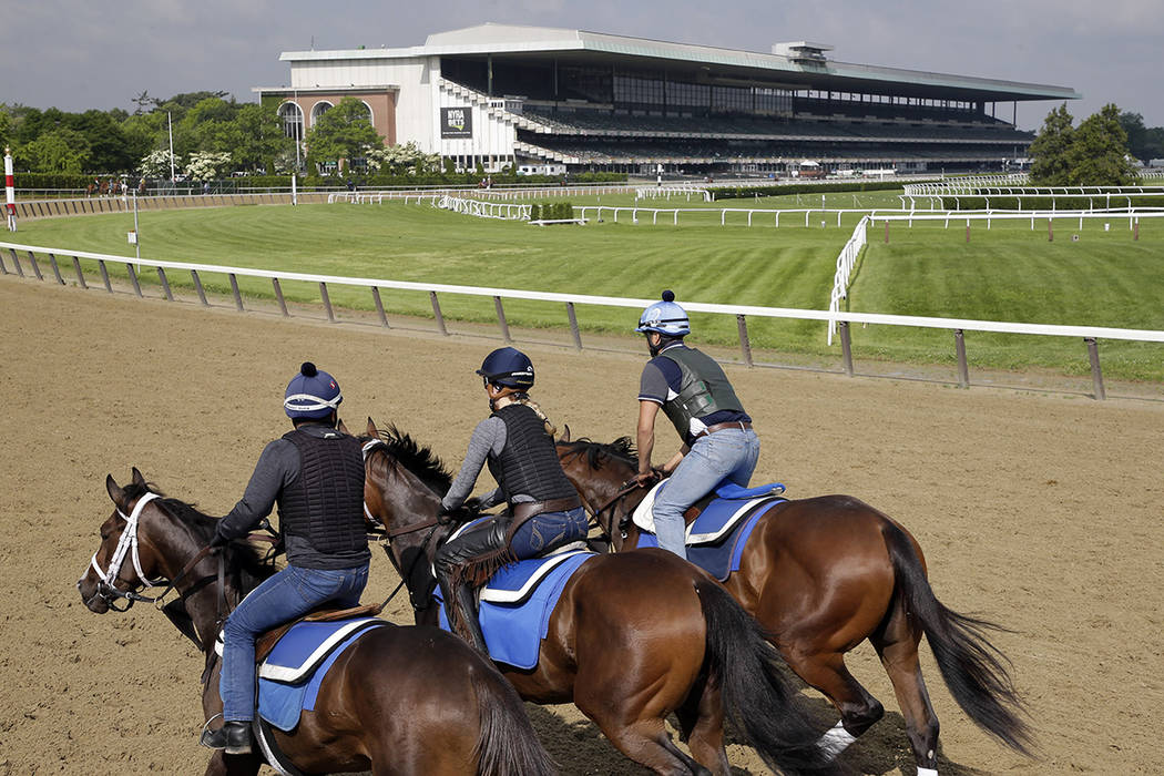 FILE--Riders workout with horses at Belmont Park in Elmont, N.Y., Thursday, June 6, 2019. (AP P ...