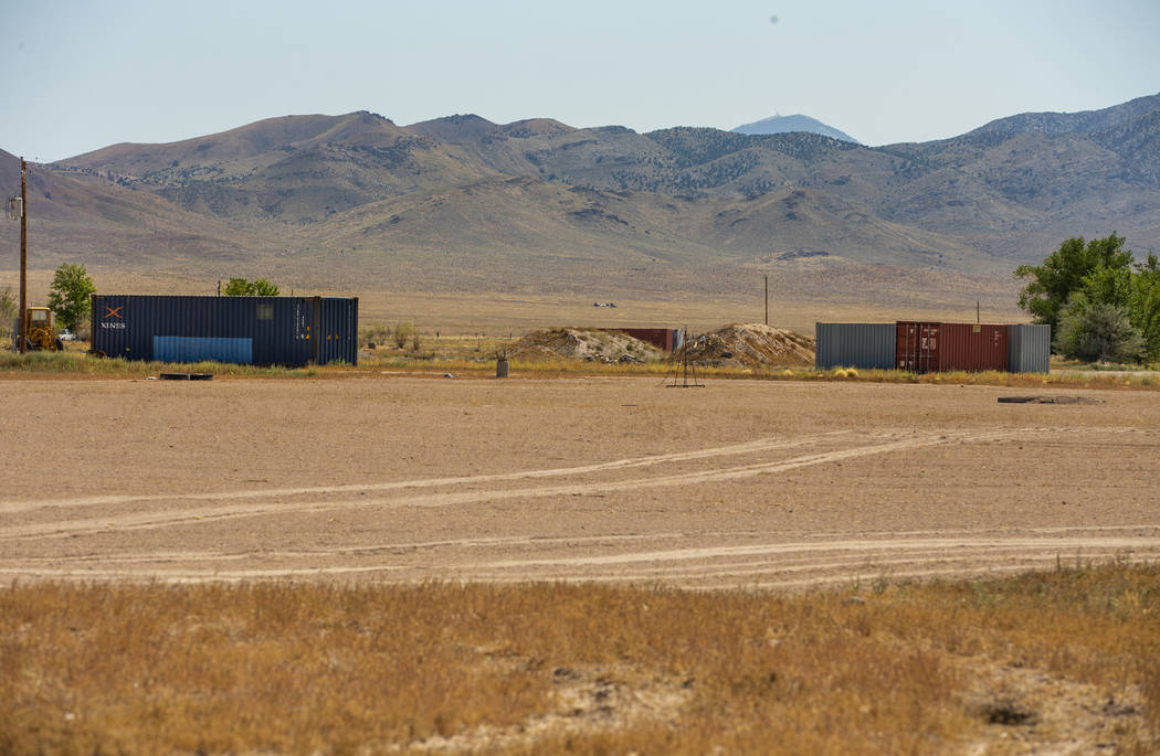 Alienstock supplies are told to be stored in two blue containers on property about the Little A ...