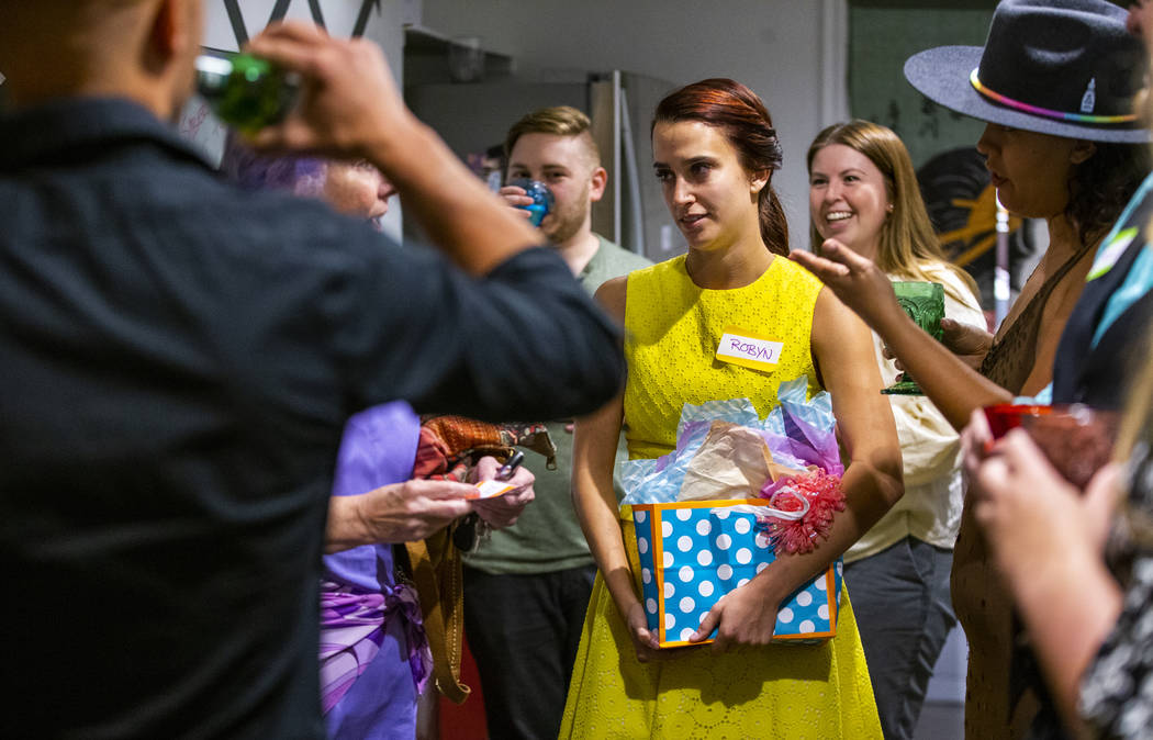 Guests arrive with gifts for the secretive Oakey Family Supper Club event on Monday, Sept. 9, 2 ...