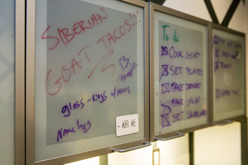 The dinner menu and check list are displayed in the kitchen during the Oakey Family Supper Club ...