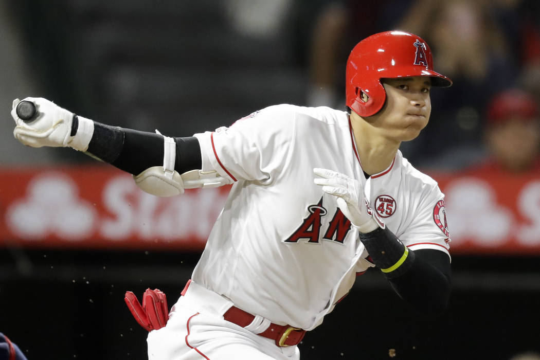 Los Angeles Angels' Shohei Ohtani, of Japan, watches a foul ball during the third inning of a b ...