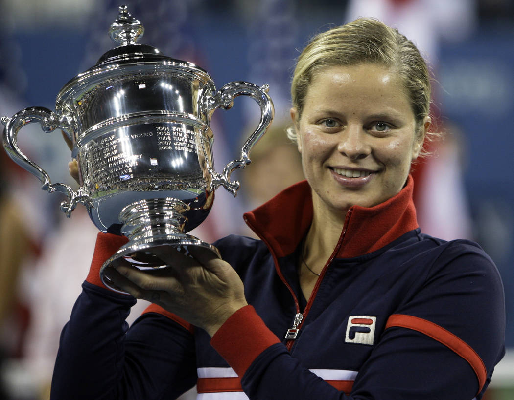 FILE - In this Sept. 13, 2009, file photo, Kim Clijsters holds the trophy after winning the wom ...