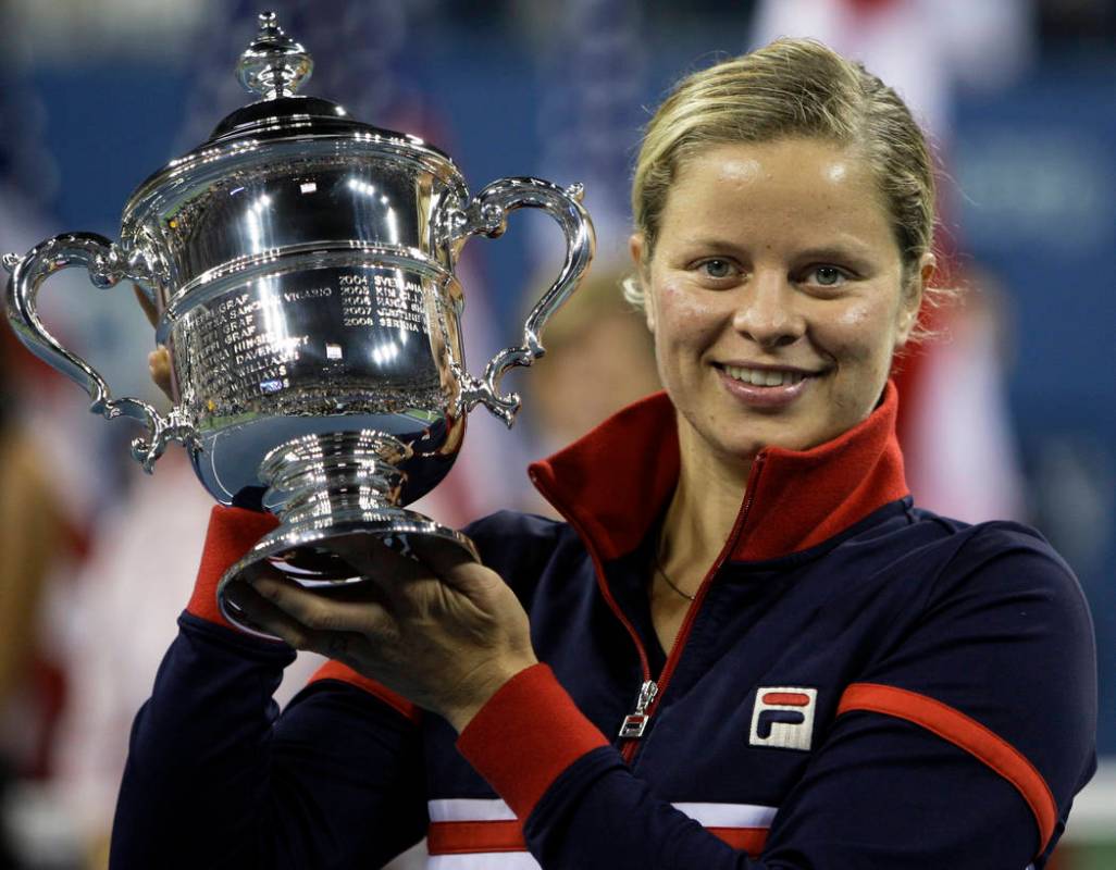 FILE - In this Sept. 13, 2009, file photo, Kim Clijsters holds the trophy after winning the wom ...