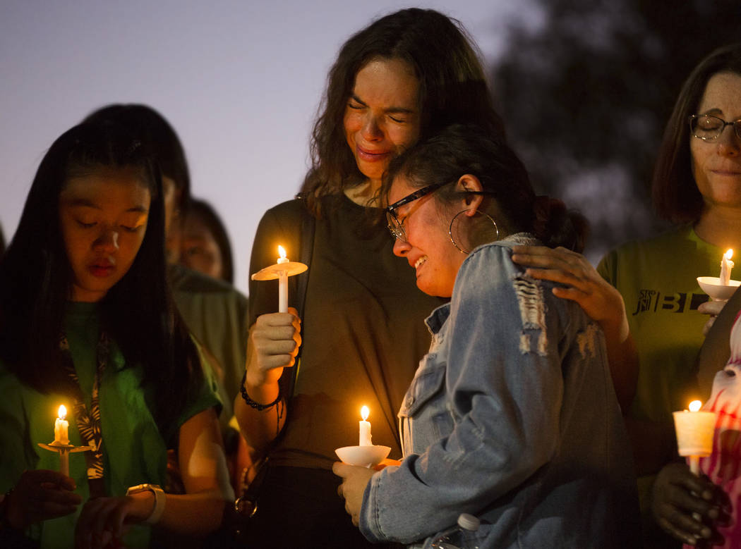 Dyana Melchor, right, is comforted by a friend at Desert Horizons Park during a vigil for Paula ...
