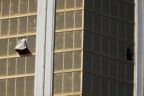 Broken windows at Mandalay Bay in Las Vegas on Oct. 2, 2017, after a shooting left 58 people de ...