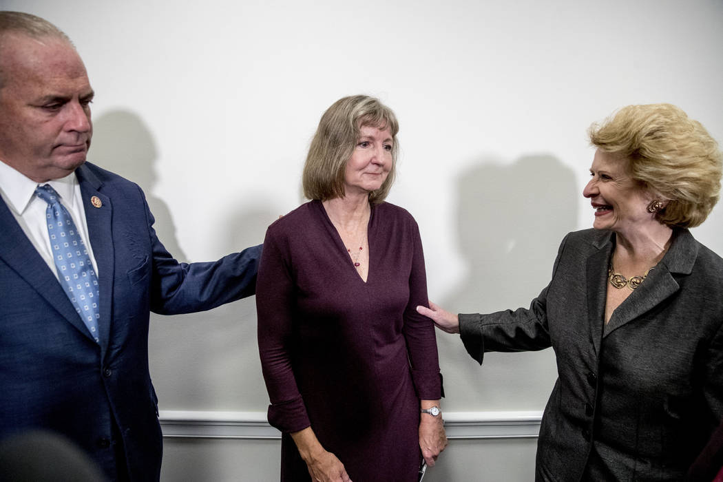 Rep. Dan Kildee, D-Mich., left, Sen. Debbie Stabenow, D-Mich., right, and Elizabeth Whelan, the ...