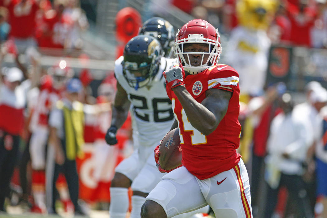 Kansas City Chiefs wide receiver Sammy Watkins, right, runs past Jacksonville Jaguars defensive ...